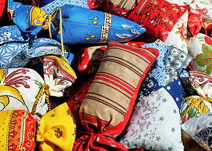 close up photography of assorted-color throw pillows thumbnail