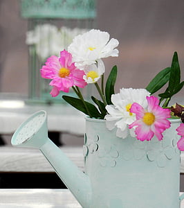 white and pink flowers inside white watering can thumbnail