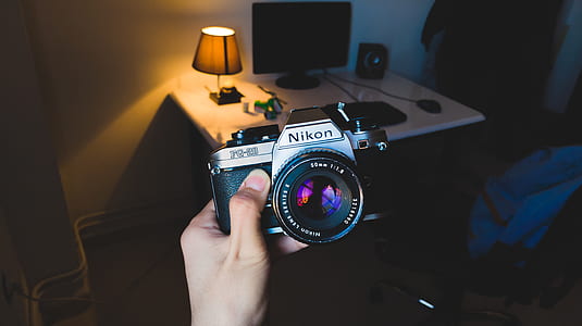 person holding Nikon MILC thumbnail