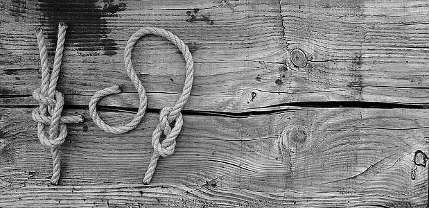 two gray ropes on wooden surface thumbnail
