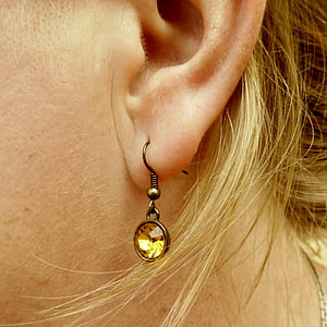 woman wearing gold-colored hook earring thumbnail