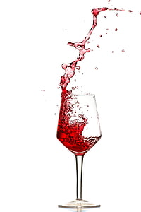 pouring of red wine in clear long stem wine glass thumbnail