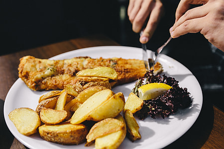 Dinner at reastaurant: Fish and Roasted Potatoes with Fresh Greek Salad thumbnail