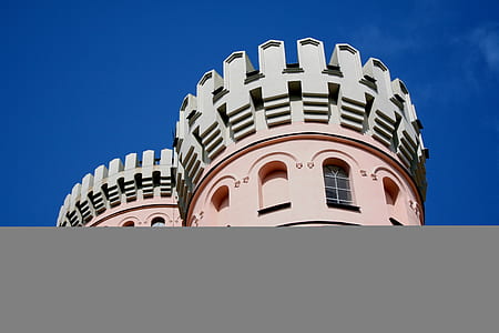 top of gray and pink concrete building thumbnail