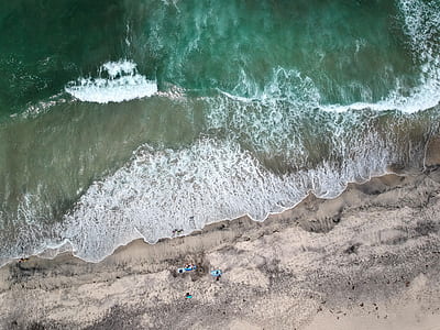 aerial view photography of ocean and shore thumbnail