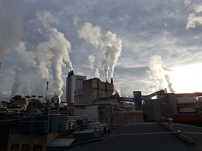 factory buildings under clouds thumbnail
