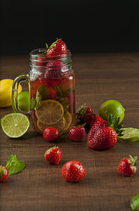 sliced lemon and strawberries on clear mason jar thumbnail