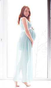 woman wearing green sleeveless dress thumbnail