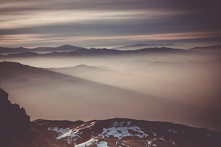 photo of mountain under white sky thumbnail