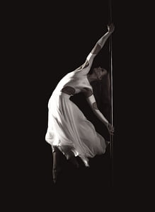 grayscale photography of woman pole dancing thumbnail