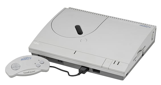 white game console with controller thumbnail