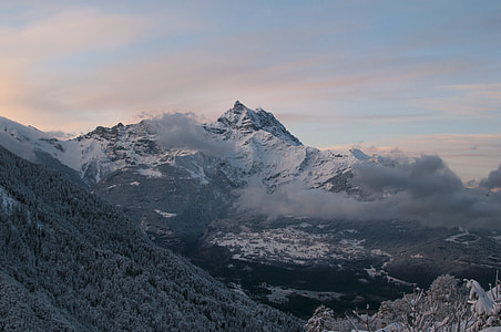 gray mountains with cloudy sky during daytime thumbnail