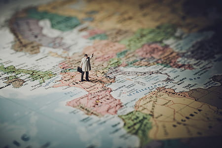 person standing on map miniature thumbnail