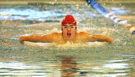 woman swimming in Olympic pool thumbnail