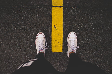 man wearing white Converse All-star low-tops thumbnail
