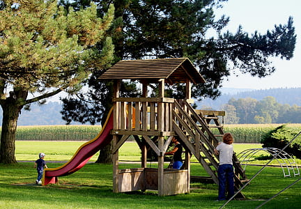 children playing near slide thumbnail