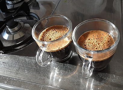 two brown liquid filled clear glass mugs thumbnail
