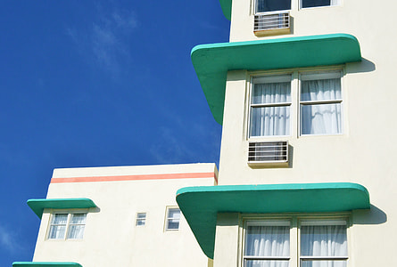 white and green building under blue sky thumbnail