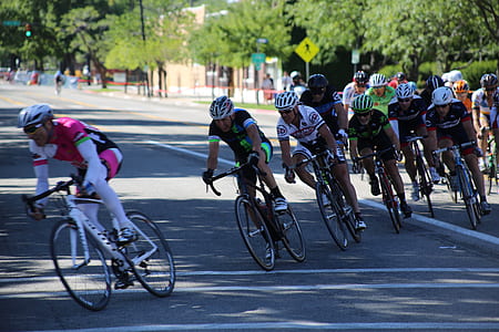 photo of cyclist in street during daytime thumbnail