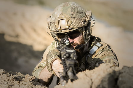person holding rifle thumbnail