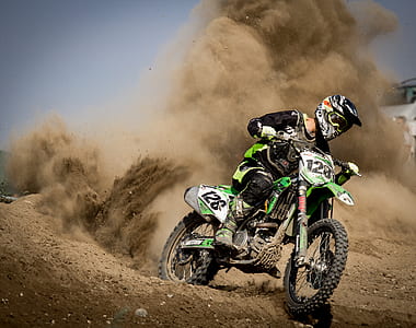 Rider Riding Green Motocross Dirt Bike thumbnail