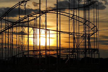 silhouette photography of roller coaster rails thumbnail