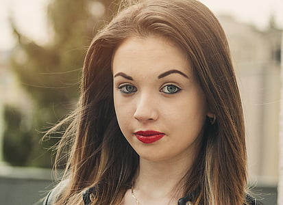 woman wearing gold-colored necklace at daytime thumbnail