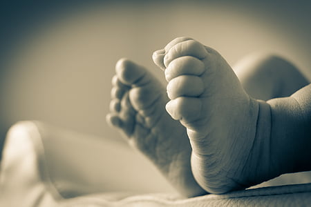 selective focus photo of baby's feet thumbnail