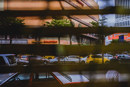 Cars Stuck in Traffic Seen trough Window Blinds thumbnail
