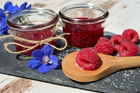 raspberry on ladle near glass bowl thumbnail