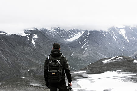 man wearing black backpack thumbnail