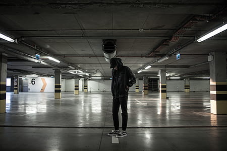 man standing at parking lot thumbnail