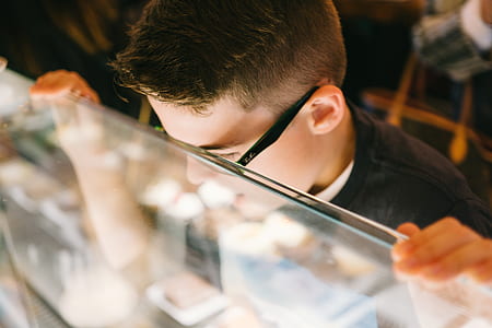 boy leaning on glass thumbnail