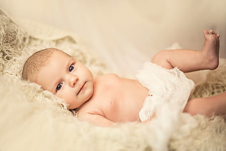 baby lying on bed thumbnail