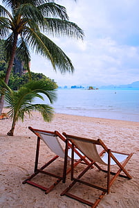 two brown wooden lounges thumbnail