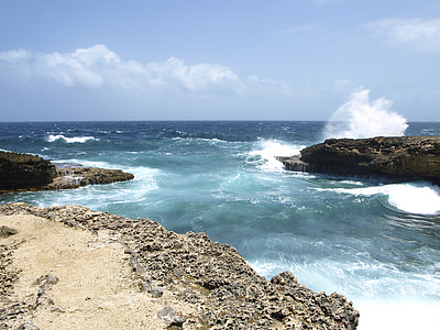 rock formation on body of water thumbnail