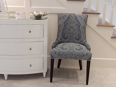photo of blue and gray chair near white wooden 3-drawer chest thumbnail