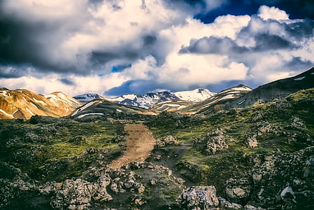 rocky mountain under white clouds during daytime thumbnail
