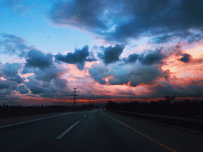 photo of concrete rode with blue clouds thumbnail