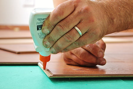 person holding glue plastic bottle thumbnail