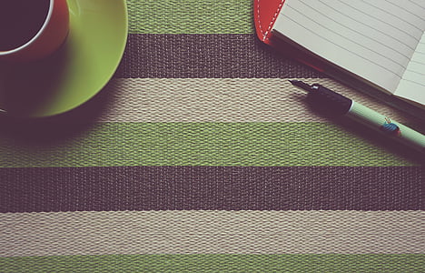 black and white pen beside white ruled paper thumbnail