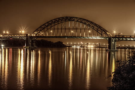 grey metal bridge with lights at night thumbnail
