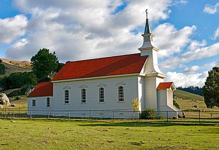 white and red concrete church under white sky thumbnail