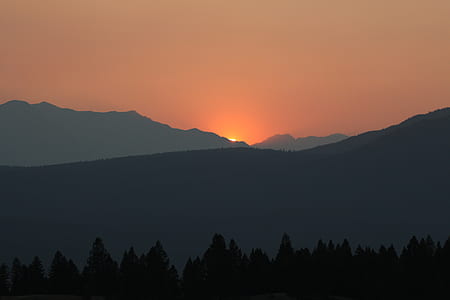 silhouette of mountain and tree during sunset thumbnail