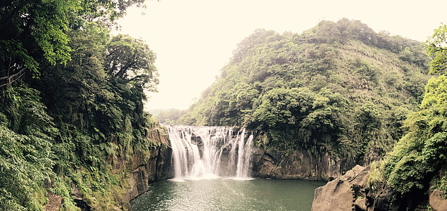 waterfalls between forest thumbnail