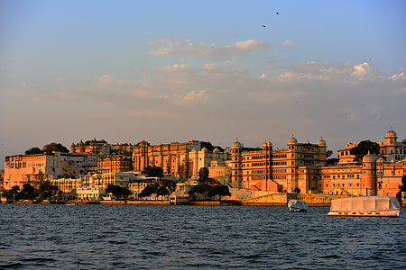 beige buildings near body of water under clear blue sky during daytime thumbnail