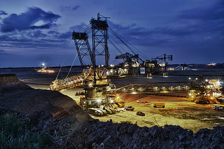 gray crane tower with lights at night time thumbnail