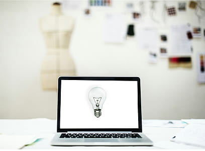 turned-on laptop with light bulb on screen thumbnail
