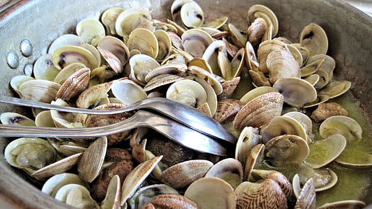 two stainless steel spoons inside cook pot thumbnail