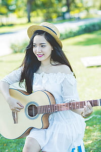 woman playing acoustic guitar thumbnail
